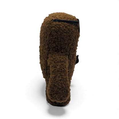 Side view of the 6.5-inch Domo plush dressed as a nerd, wearing thick black glasses with tape on the bridge and a black bow tie.