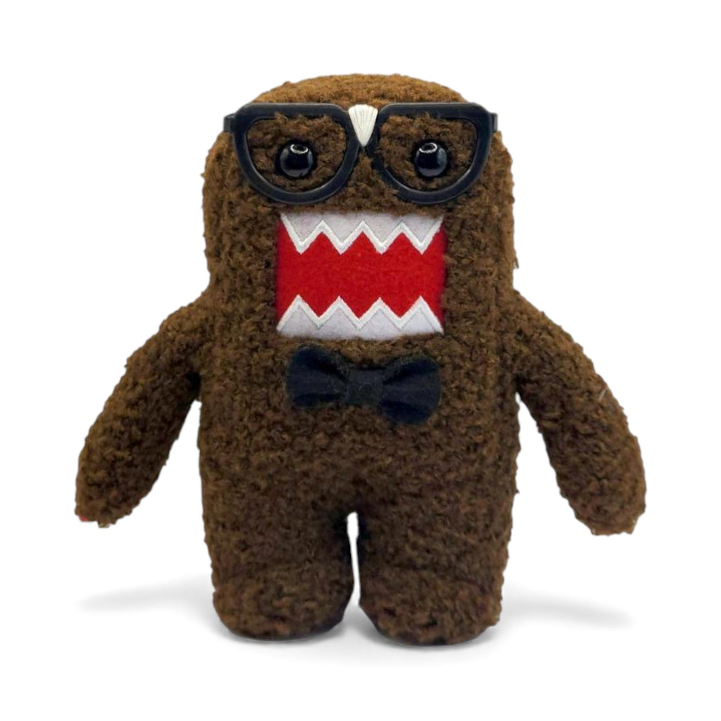 Product view of the 6.5-inch Domo plush dressed as a nerd, wearing thick black glasses with tape on the bridge and a black bow tie.