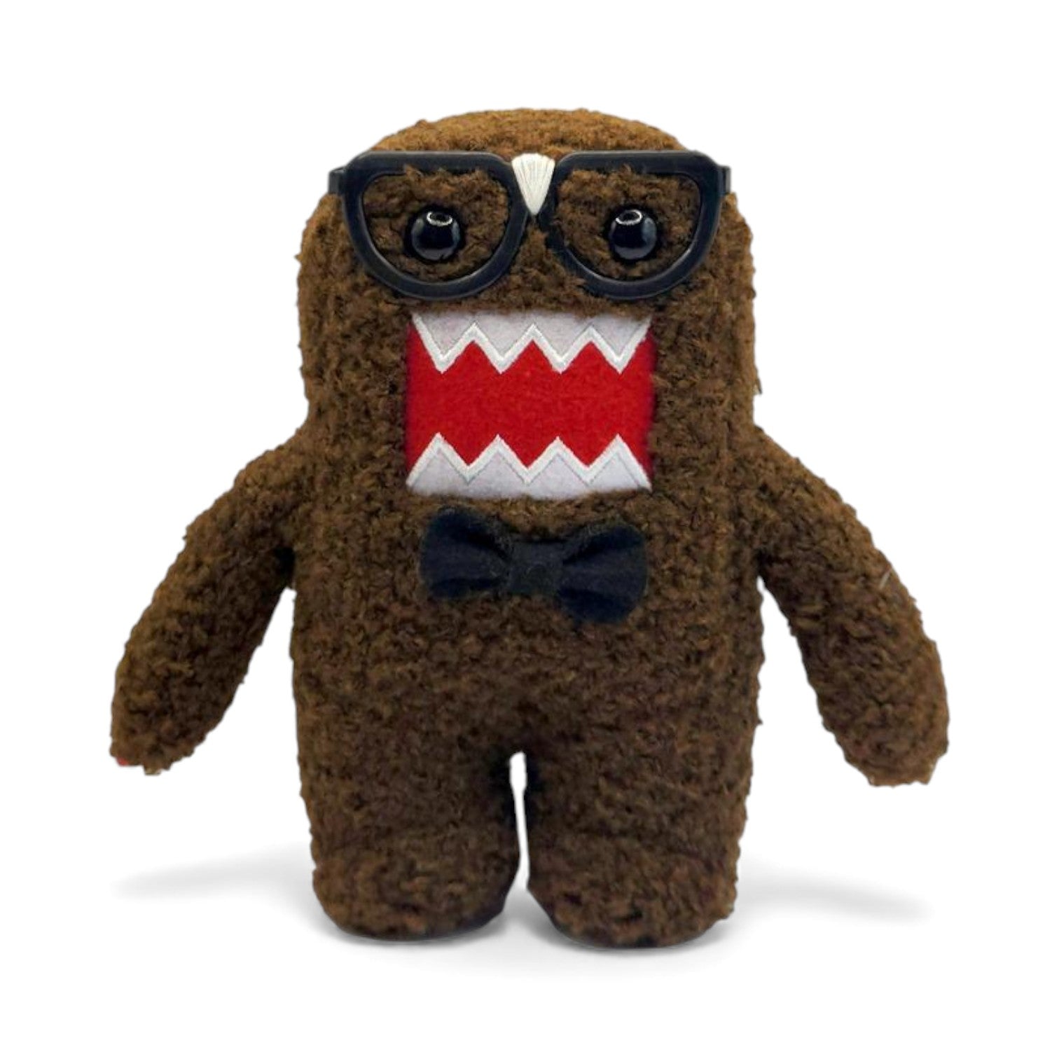 Product view of the 6.5-inch Domo plush dressed as a nerd, wearing thick black glasses with tape on the bridge and a black bow tie.