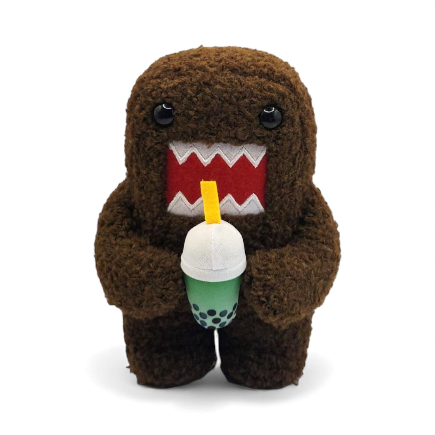 Product view of the 6.5-inch Domo plush, a brown fuzzy rectangular monster with a large open mouth holding a green boba tea cup.