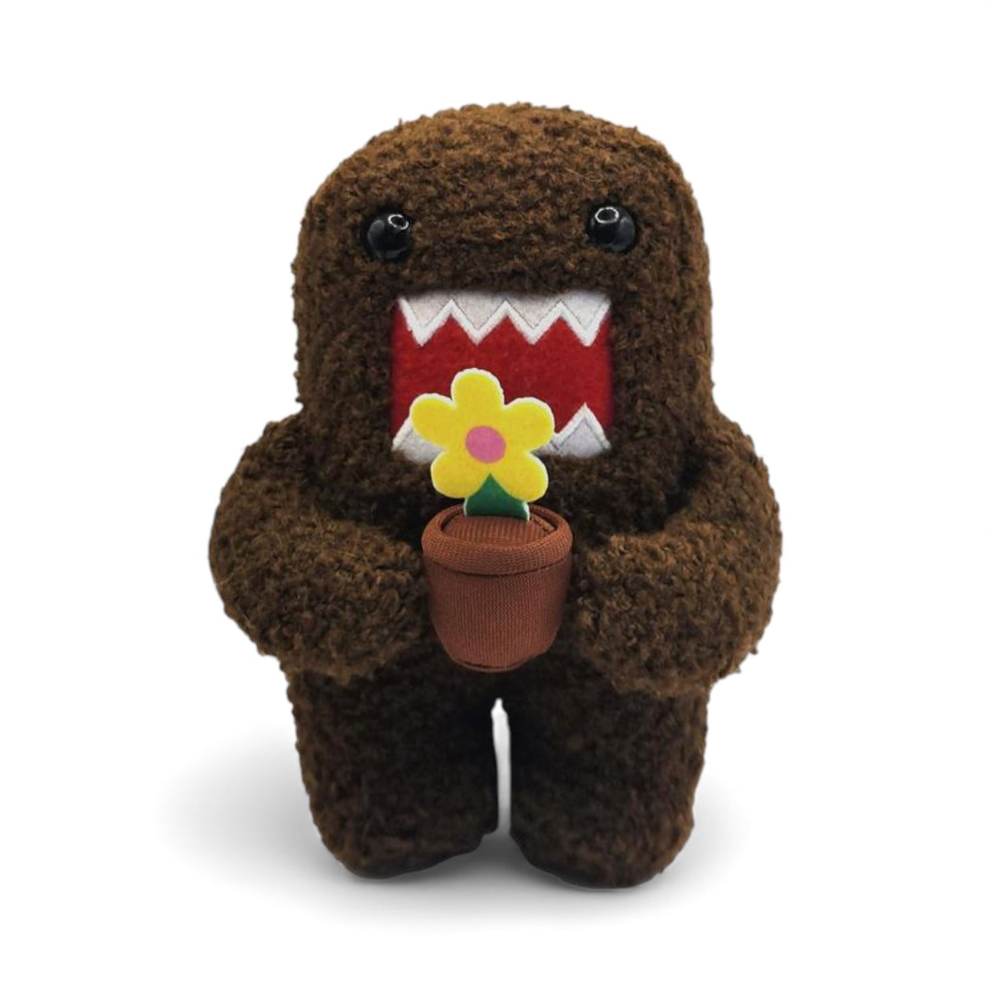 Product view of the 6.5-inch Domo plush, a brown fuzzy monster holding a small brown pot with a yellow flower.