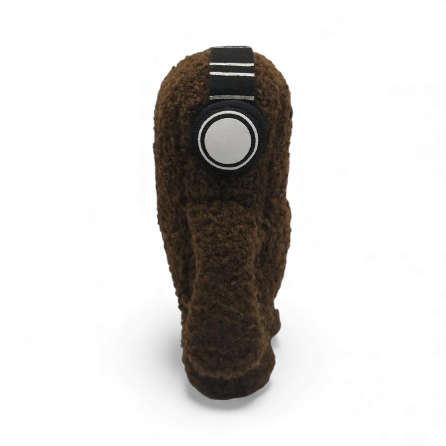 Side view of the 6.5-inch Domo plush, a brown fuzzy monster wearing black
and white headphones.