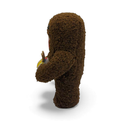 Other side view of the 6.5-inch Domo plush, a brown fuzzy monster with an open mouth holding a bowl of ramen noodles with chopsticks.