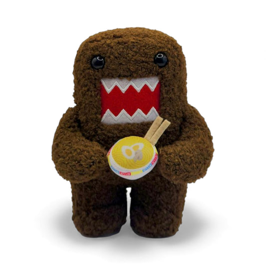 Product view of the 6.5-inch Domo plush, a brown fuzzy monster with an open mouth holding a bowl of ramen noodles with chopsticks.