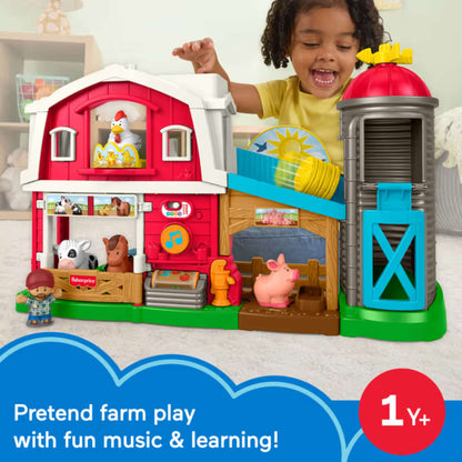 Fisher-Price Little People Caring Fun Animal Farm playset featuring a red two-story barn, a farmer figure, and animal figures.