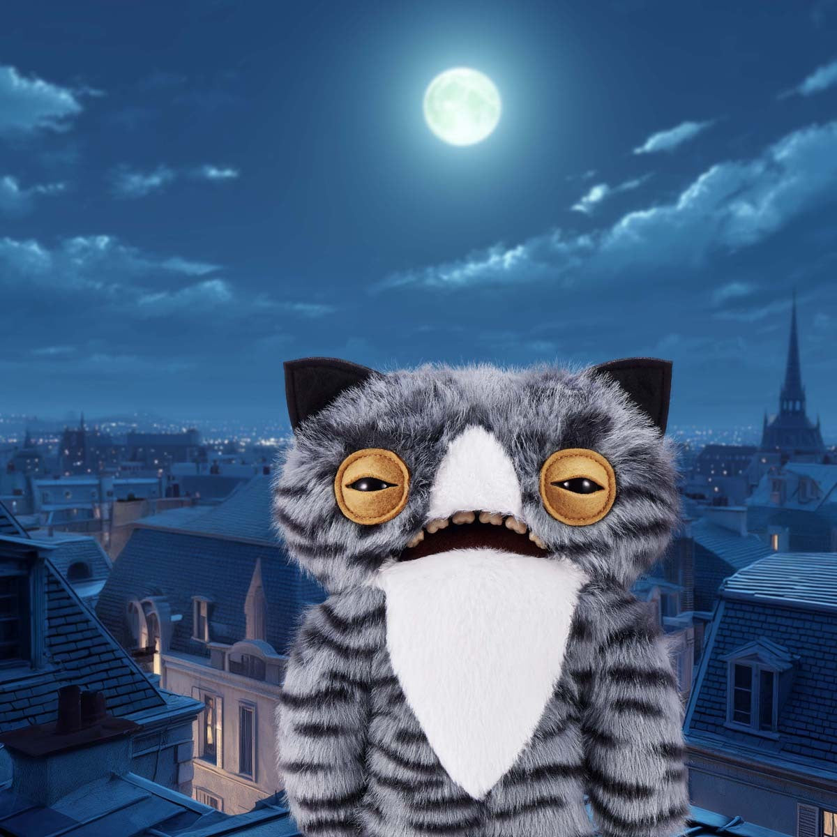Fuggler Alley Cats Wide Eyed Cat plush with large eyes against a night sky with a full moon and cityscape.