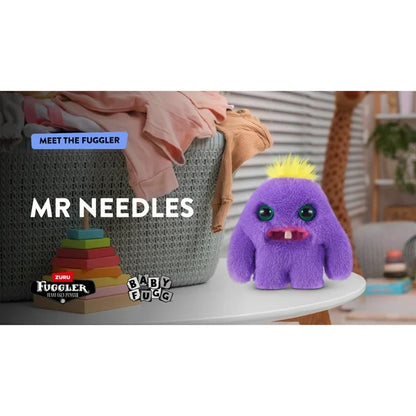 Purple plush toy with yellow hair on a white surface, with 'Meet the Fuggler' text and product logos.