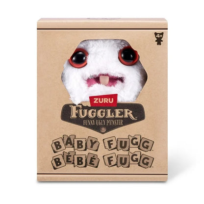 Display box for A small, white Fuggler Baby Fugg plush toy (Rabid Rabbit) with long white rabbit ears, large red eyes, one white baby tooth showing in a pink mouth, and a spiky orange tuft of hair on top.