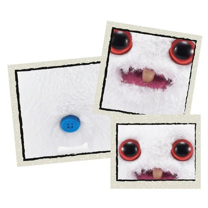 Close Up of A small, white Fuggler Baby Fugg plush toy (Rabid Rabbit) with long white rabbit ears, large red eyes, one white baby tooth showing in a pink mouth, and a spiky orange tuft of hair on top.
