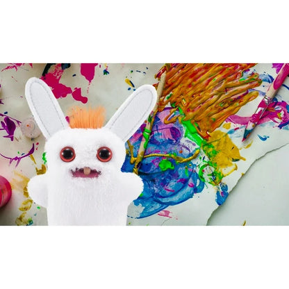 White plush toy with red eyes on a colorful painting background