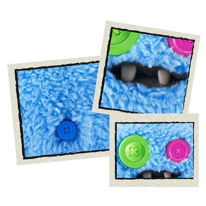 Close up of A small, shaggy blue Fuggler Baby Fugg plush toy (SaBQuoosh) with mismatched button eyes (one green, one pink), two white baby teeth showing, and a spiky pink tuft of hair on top.