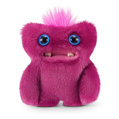 A small, reddish-pink Fuggler Baby Fugg plush toy (Sir Belch) with large blue eyes, two white baby teeth showing, and a bright pink tuft of hair on top.