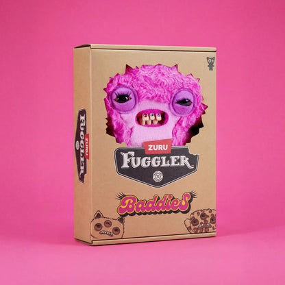 A cardboard product box for ZURU Fuggler Baddies, featuring a large pink furry monster face cutout on the front, set against a solid pink background.