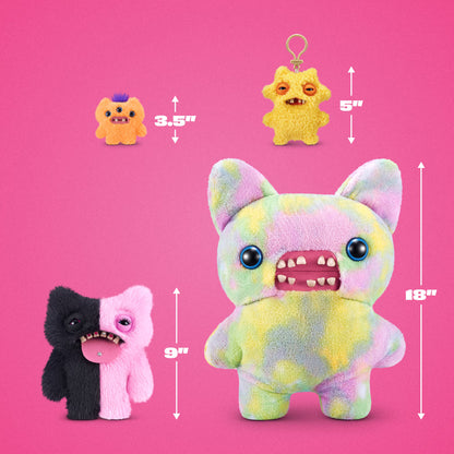Three fuzzy monster plush toys shown on a bright pink background with size arrows and labels: a small orange one labeled 3.5 inches, a small yellow hanging keychain one labeled 5 inches, and a larger split black-and-pink one labeled 9 inches.