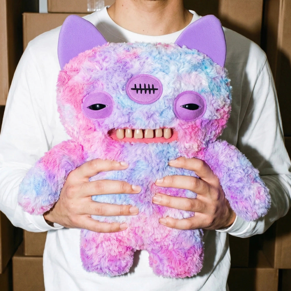 Fuggler Big Fuggs Series 2 Annoyed Alien jumbo 18-inch plush featuring purple fur, long purple hair, three eyes, pointed ears, and human-like teeth.