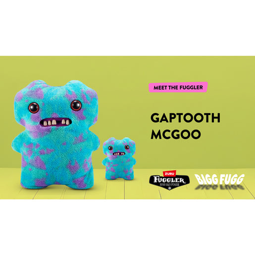 Blue and purple plush toy with 'Meet the Fuggler' text on a green background. Fuggler Bigg Fugg Gaptooth McGoo plush by ZURU, 18-inch