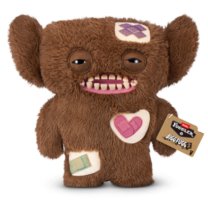 Fuggler Bigg Fugg Grumpy Grumps 18-Inch Plush featuring fuzzy brown fur, human-like teeth, and large heavy-lidded eyes.