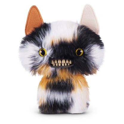 A 9-inch Fuggler Butt Ugly Pet (Cheezee Calico Cat) plush toy. It has shaggy calico fur (black, white, orange), mismatched ears, wide yellow eyes, and a full set of realistic human teeth.