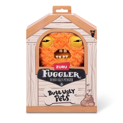 A 9-inch Fuggler Butt Ugly Pet (Cod Father Gold Fish) plush toy. It is shaggy and orange, shaped like a fish, with side fins, squinting yellow-lidded eyes, and a mouth with realistic human teeth in a display box. 