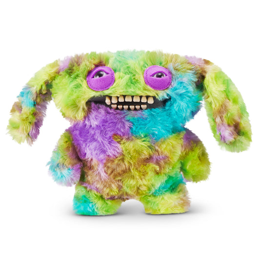 A 9-inch Fuggler Butt Ugly Pet (Count Underoo McGoo Cockapoo) plush toy. It has shaggy, multi-colored tie-dye fur (green, blue, purple), long floppy ears, squinting purple eyelids, and a wide mouth full of realistic human teeth.
