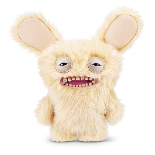 A 9-inch Fuggler Butt Ugly Pet (Mr Buttons Golden Retriever) plush toy. It has shaggy, light golden-yellow fur, very large floppy ears, squinting eyes, and a wide mouth full of realistic human teeth.