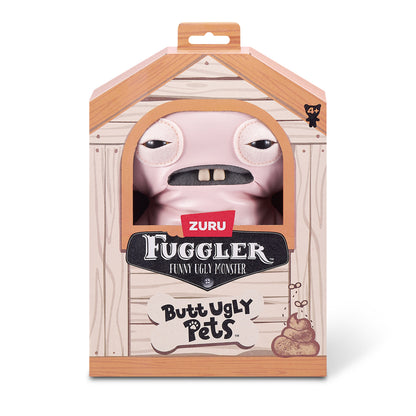 A 9-inch Fuggler Butt Ugly Pet (Uncladimir Tootin Hairless Rat) toy. It is made of smooth pink faux leather, with large rat ears, squinting stitched eyes, and two large human-like teeth inside display box. 