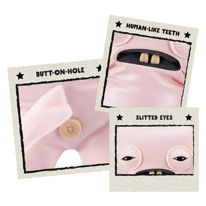 Close up of features for A 9-inch Fuggler Butt Ugly Pet (Uncladimir Tootin Hairless Rat) toy. It is made of smooth pink faux leather, with large rat ears, squinting stitched eyes, and two large human-like teeth.