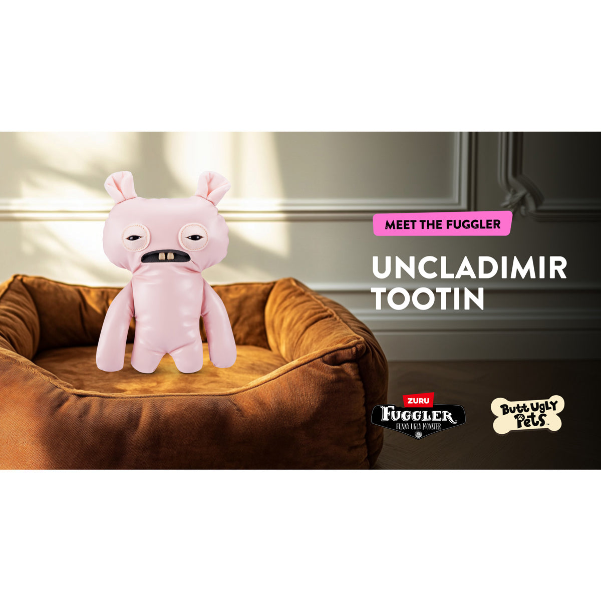 Pink plush toy on a brown pet bed with branding text