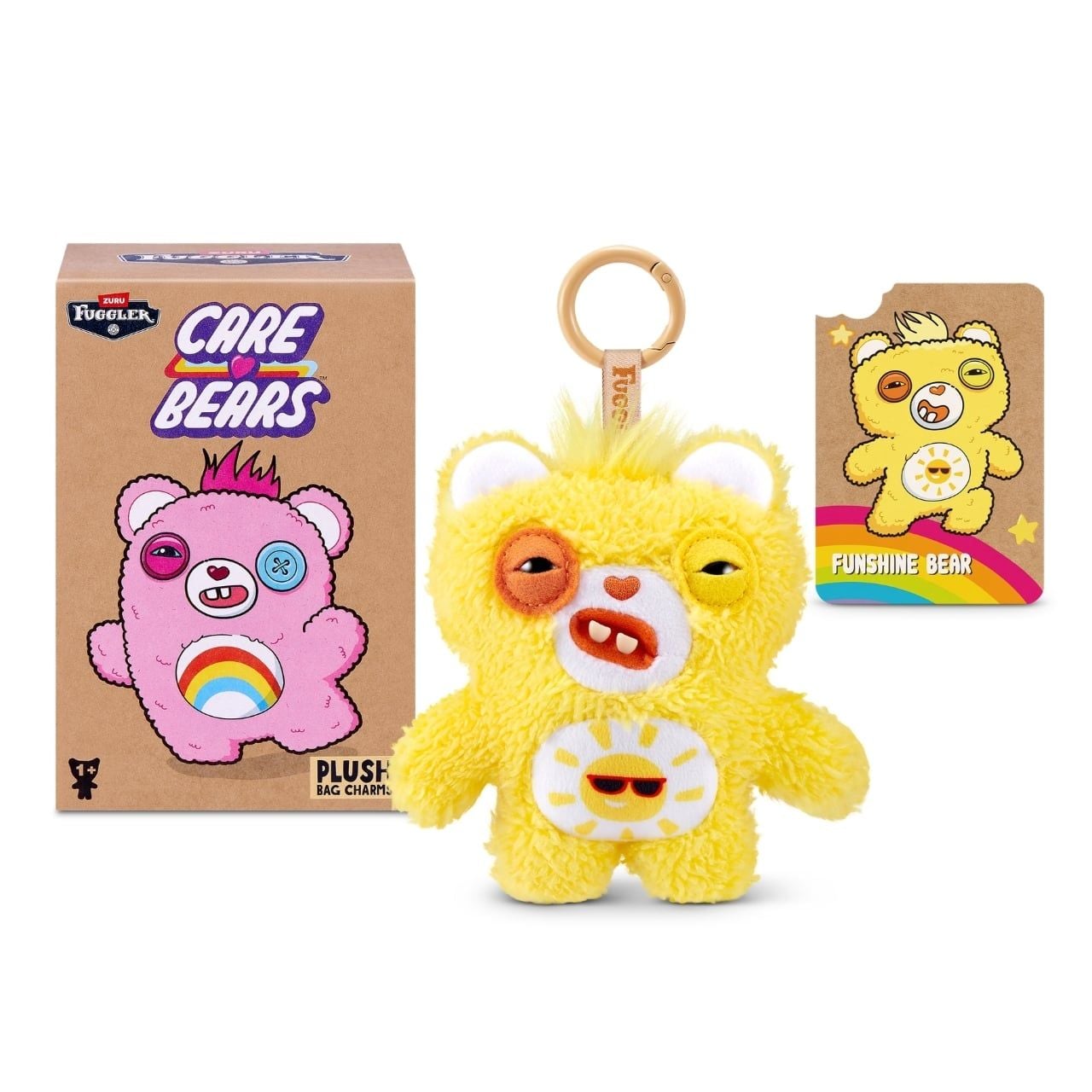 Fuggler Care Bears blind box packaging alongside an assortment of plush bag charms featuring Care Bear designs and human-like teeth.