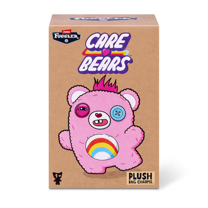 Fuggler Care Bears blind box packaging alongside an assortment of plush bag charms featuring Care Bear designs and human-like teeth.