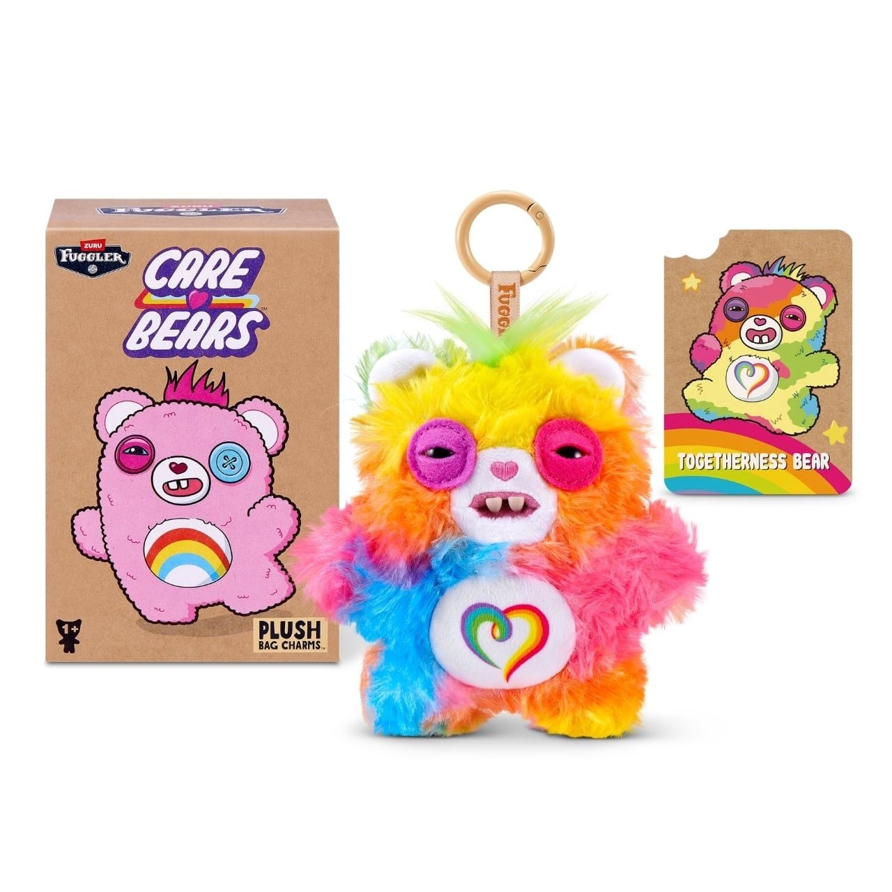 Fuggler Care Bears blind box packaging alongside an assortment of plush bag charms featuring Care Bear designs and human-like teeth.