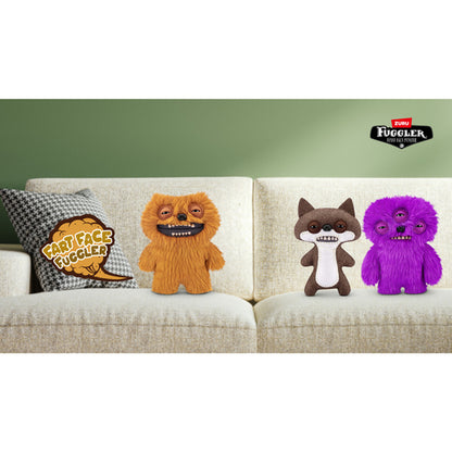 Four fluffy toys on a couch with a green wall background, featuring the Fuggler logo. Fuggler Fart Face Count Underoo Mcgoo Plush by ZURU, Series 1