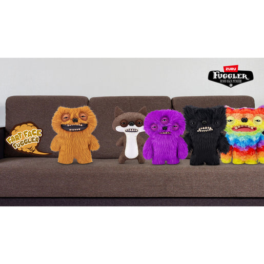 Five colorful plush toys on a brown couch with 'Zuru' branding. Fuggler Fart Face Munch Munch Plush by ZURU, Series 1