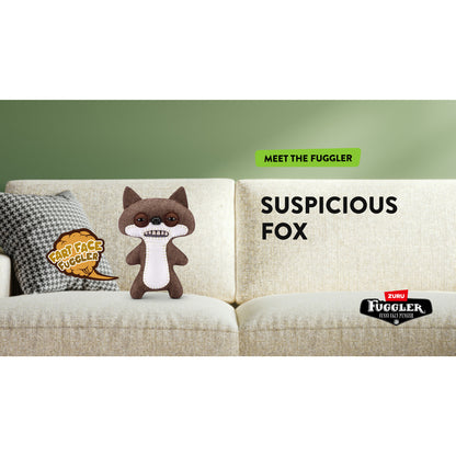 Plush toy fox on a couch with 'Fuggler' branding and text. Fuggler Fart Face Suspicious Fox Plush by ZURU, Series 1, 9-inch