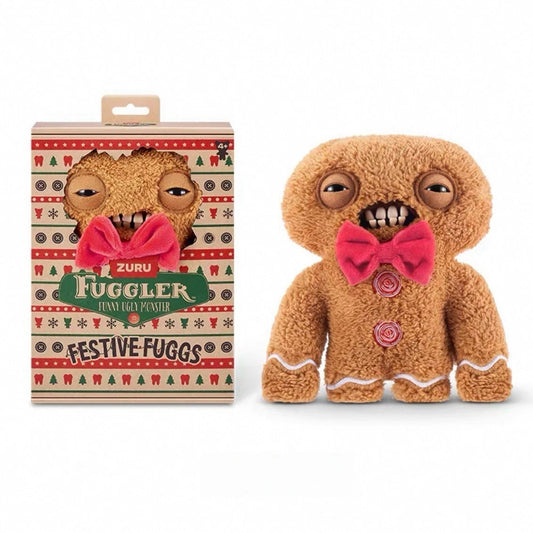 Fuggler Festive Fuggs Series 1 Gingerbread 9-inch plush featuring brown fur, a red bow tie, white icing squiggles, red swirl buttons, and human-like teeth.