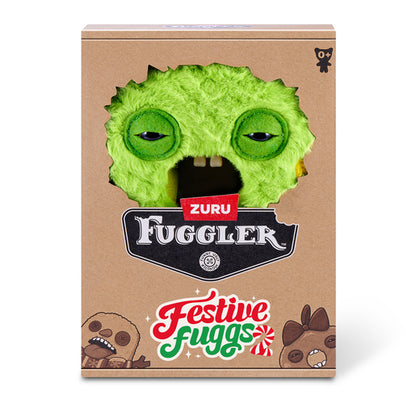 Zuru Fuggler 'Festive Fuggs' holiday-themed plush toy in its original brown cardboard packaging, featuring a green fuzzy monster face design.
