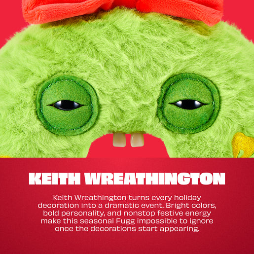 Close-up of a plush green character face with large round eyes, a red bow, and part of a red mouth, above a red text panel that reads 'KEITH WREATHINGTON'.