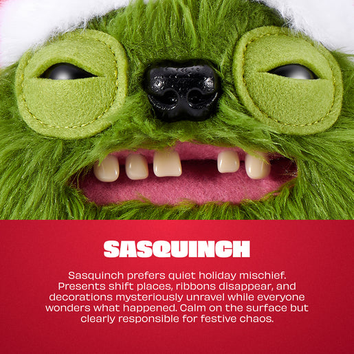 A close-up of a green plush sasquinch character face with large round eyes, a black nose, and an open mouth showing cream-colored teeth and pink inner lips. A red text panel at the bottom reads 'SASQUINCH' with a short descriptive holiday quote.