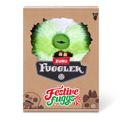 A cardboard product box for Zuru Fuggler 'Festive Fuggs' featuring a die-cut window showing a green furry monster face with a single eye and teeth, on a white background.