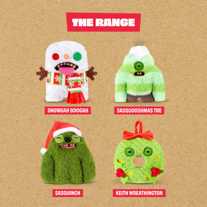 A product display graphic titled 'THE RANGE' showing four Christmas-themed plush toys on a textured tan background: a white snowman wearing a red and green Santa outfit, a green and white furry creature, a green Sasquinch wearing a red Santa hat, and a green ring-shaped creature with a red bow and ornaments.