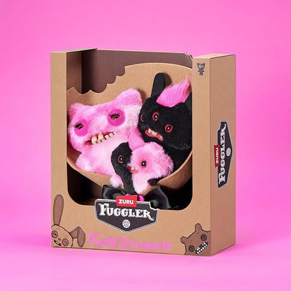 Fuggler Fugg Bouquets Plush Set featuring two 9-inch and one 3.5-inch pink and black monster plush toys wrapped in craft paper with a black ribbon.