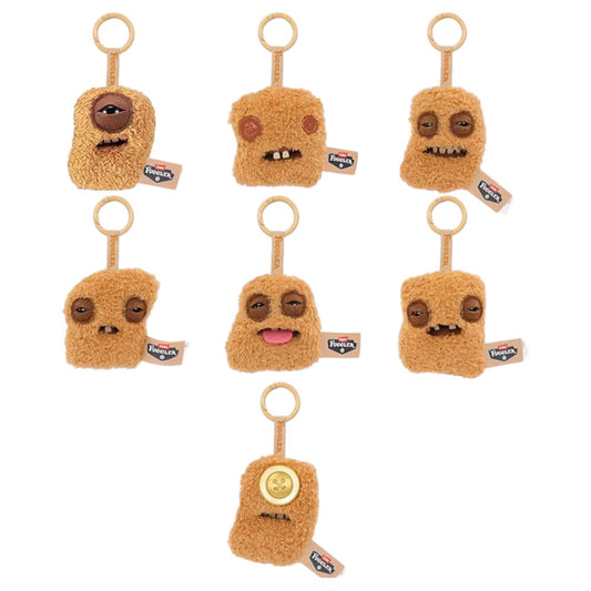 Seven variations of Fuggler Fugg Nuggets plush keyrings featuring funny-ugly monster faces with human-like teeth on fuzzy chicken nugget shapes.