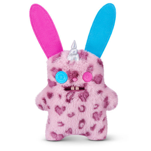 Fuggler Fugglercorns Rabid Rabbit plush toy with pink and dark purple spotted fur, tall ears with blue and pink insides, a silver unicorn horn, mismatched button eyes, and two large buck teeth.