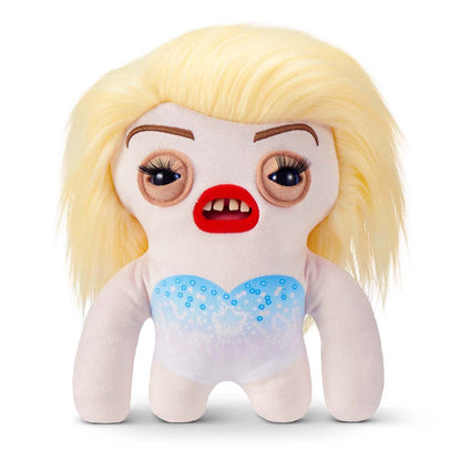 Fuggler Fuggstars Series 1 Fleeting Fartlet plush, a pale monster toy with a blonde wig, heavy makeup, and a blue sparkly outfit.