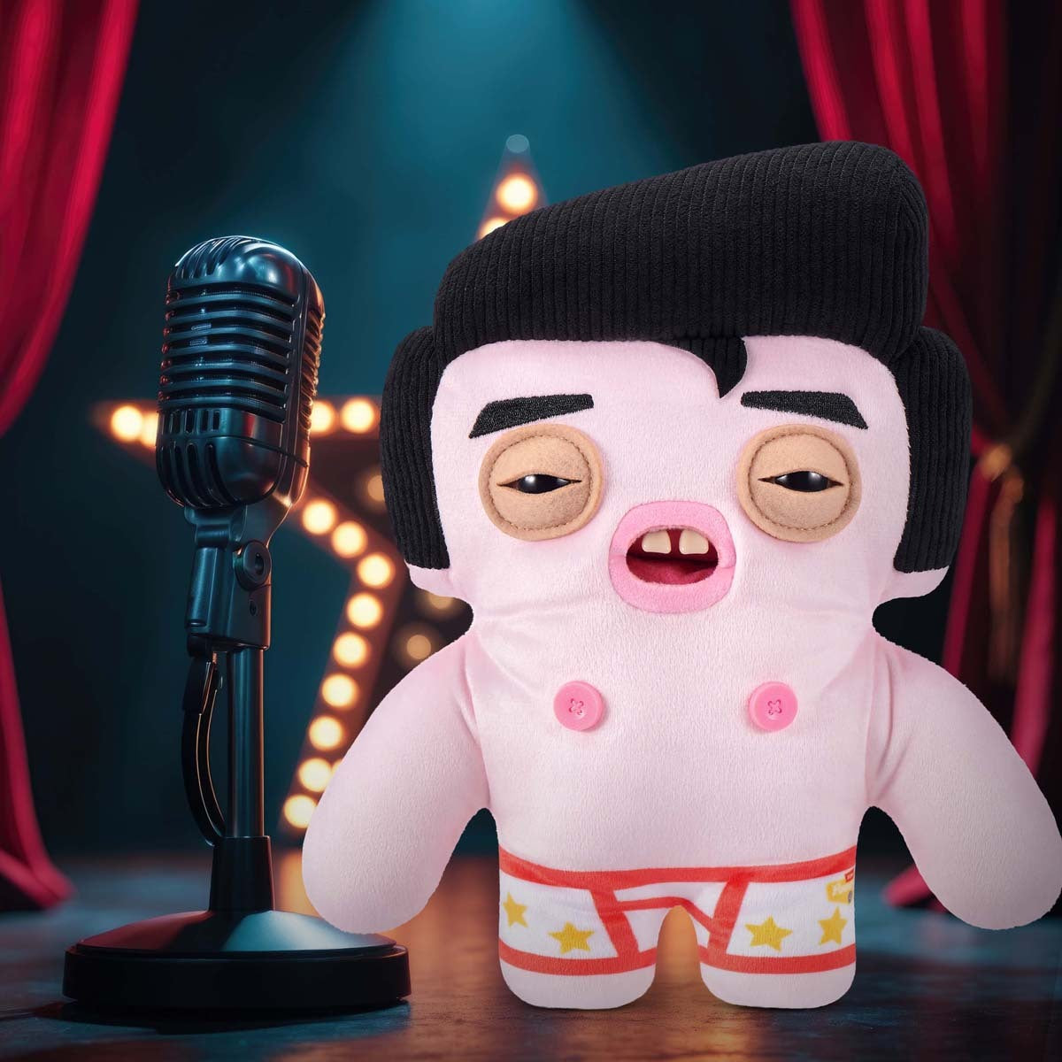 Fuggler Fuggstars Series 1 Greazee plush beside a microphone on a stage