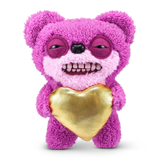 Fuggler Gold Fuggs Series 1 Teddy Bear Nightmare 9-inch plush featuring pink fuzzy fur, realistic teeth, and a golden pleather heart.