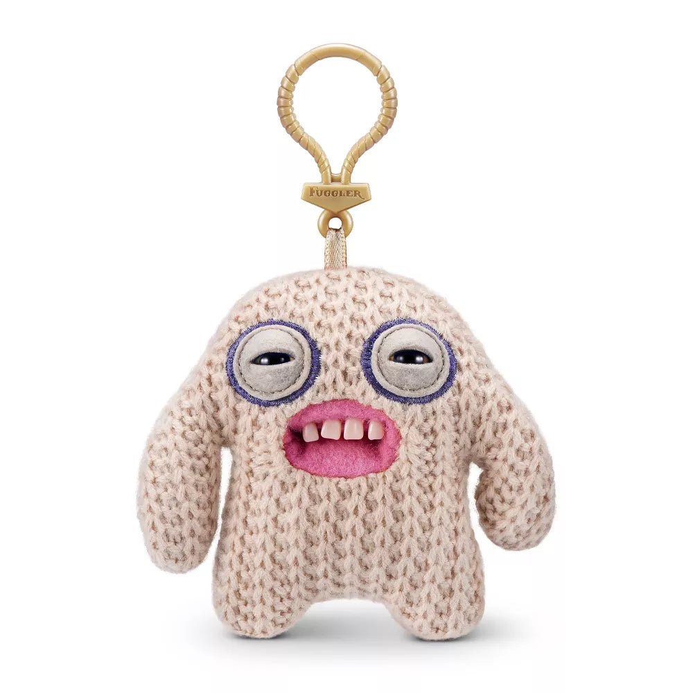 Shop the 5-inch Fuggler Series 5 Mr. Needles Cream keyring plush. A knitted cream monster featuring long arms, human-like teeth, and a backpack clip.