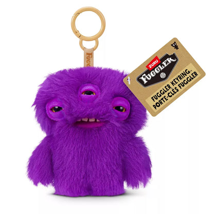 Fuggler Series 6 Annoyed Alien 5-inch keyring plush in Purple variation, featuring long-haired purple fur, three eyes, and signature human-like teeth.