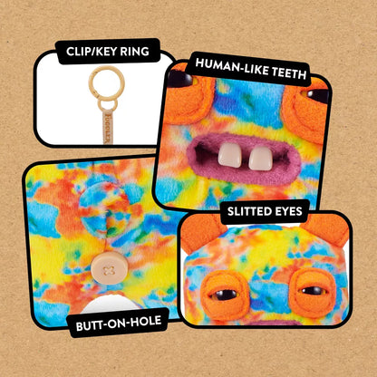 close up of features for Fuggler Series 6 Rabid Rabbit 5-inch keyring plush in Multi-Color variation, featuring tie-dye fleece fur, long orange ears, and two buck teeth.