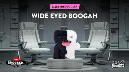 Two half-black, half-white plush toys on a futuristic chair with text 'Meet the Fuggler Wide Eyed Boogah' above.